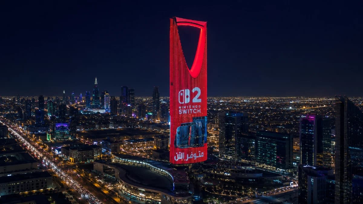 Aerial night view of Kingdom Centre lit red for a Nintendo Switch Available Now campaign
