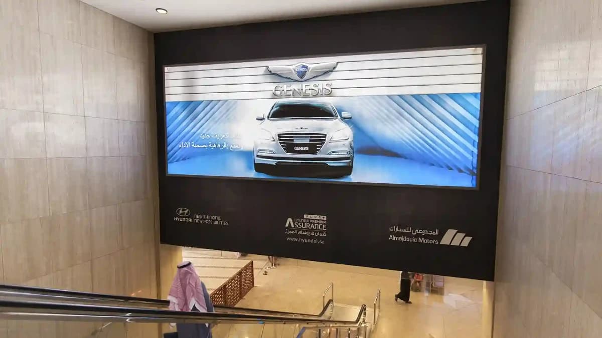 Digital advertising screen inside a Saudi airport