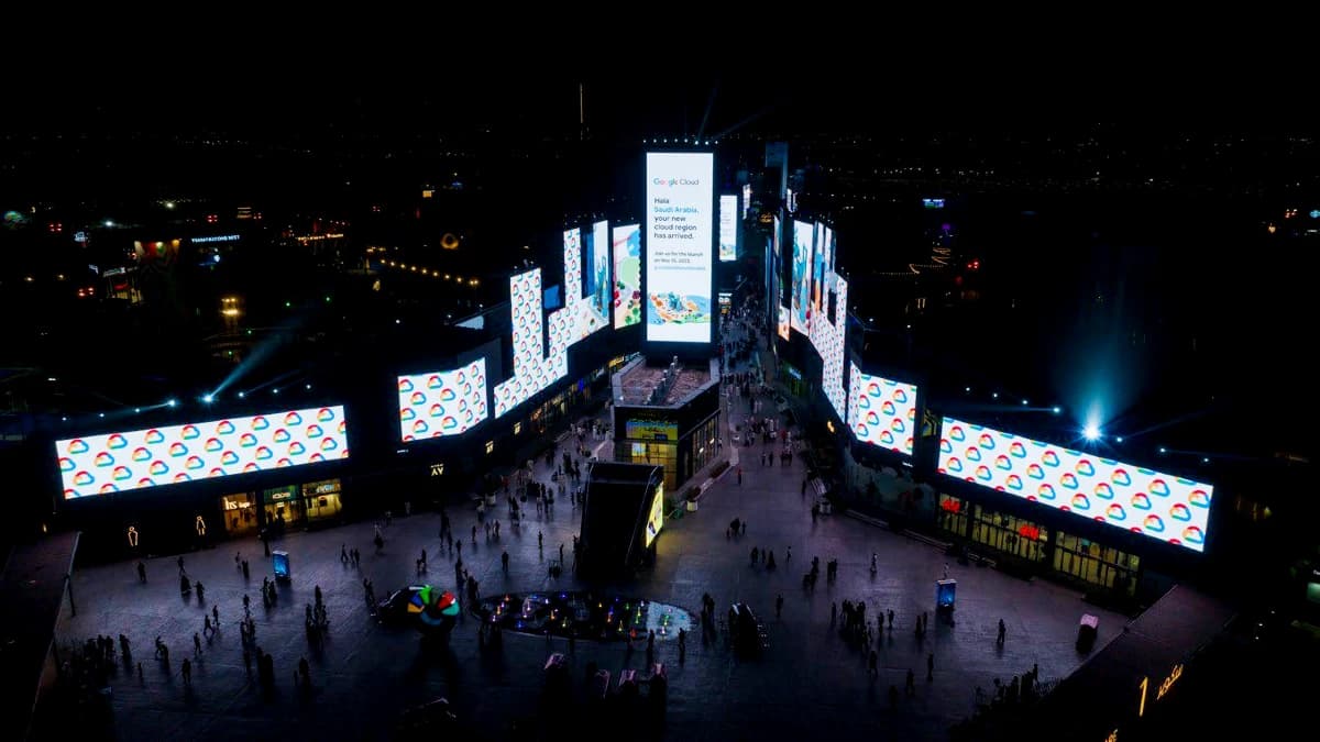 Boulevard City night screens running a synchronised Google Cloud launch campaign